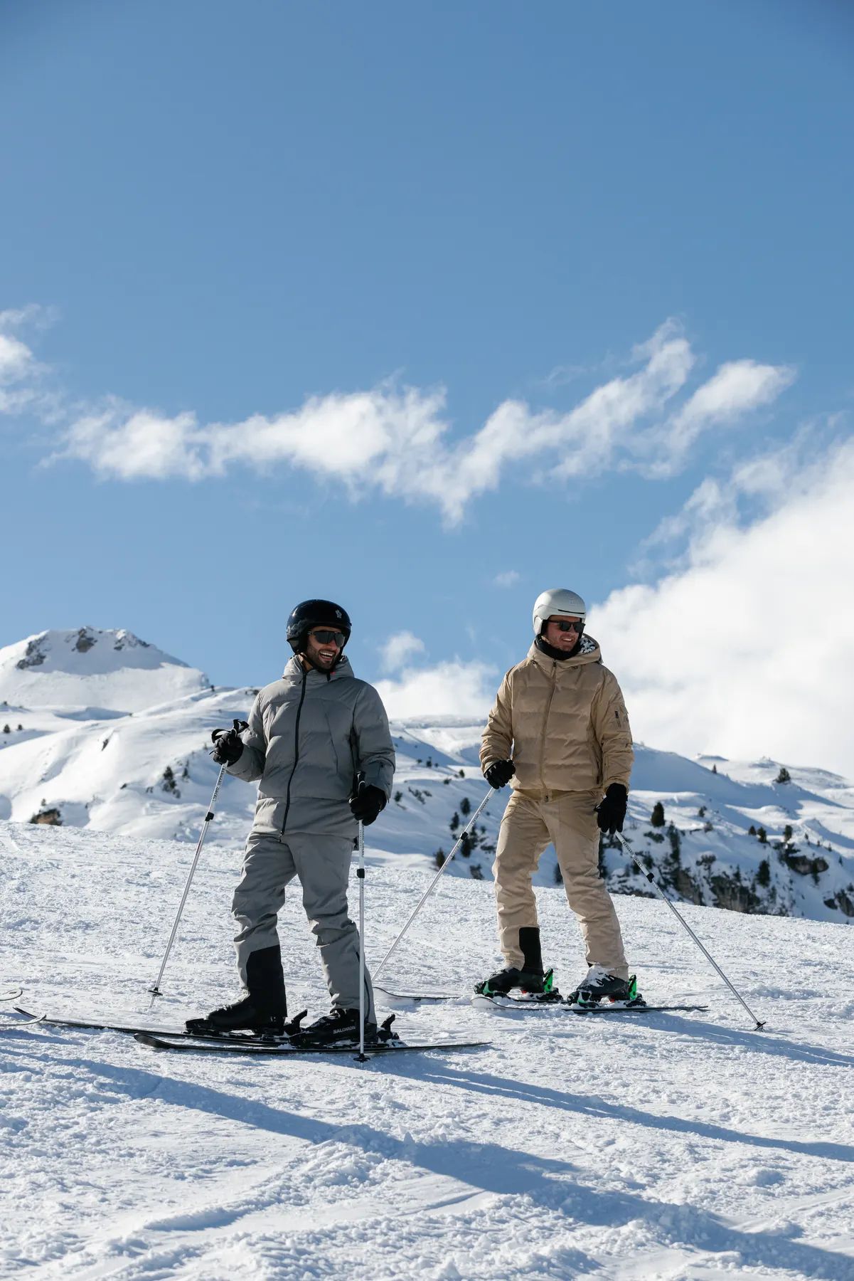 Two friends skiing together during a luxury ski holiday in Courchevel.